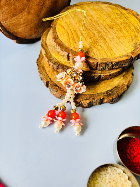 Orange Tassel Lumba Rakhi with Roli Chawal
