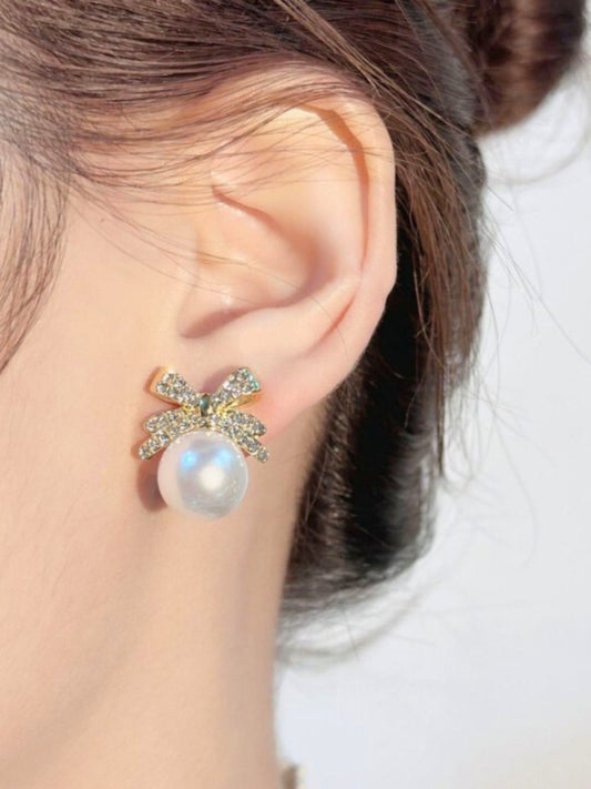 Gold-toned Bow shaped Pearl Dangler Earrings for Women