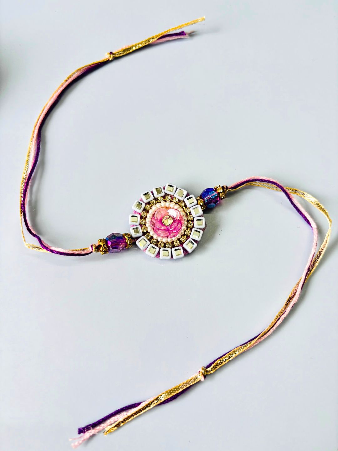 Purple Floral Lumba Rakhi Set for Bhaiya Bhabhi with Roli Chawal