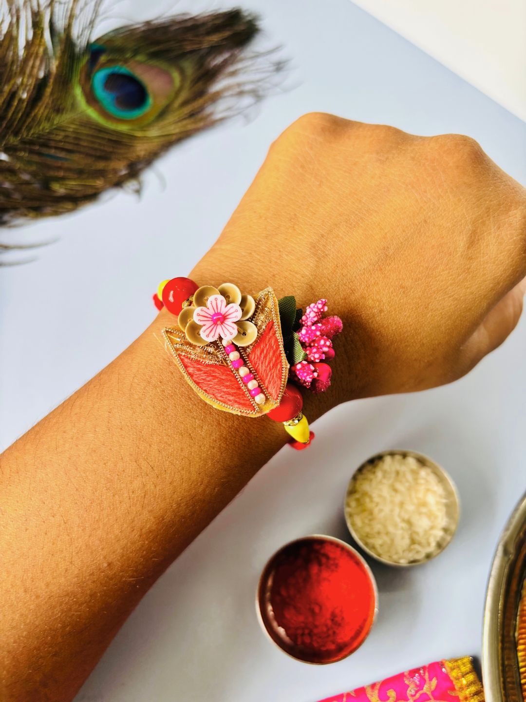 Cute Floral Rakhi with Roli Chawal for Brother (Pack of 2: Blue and Orange)
