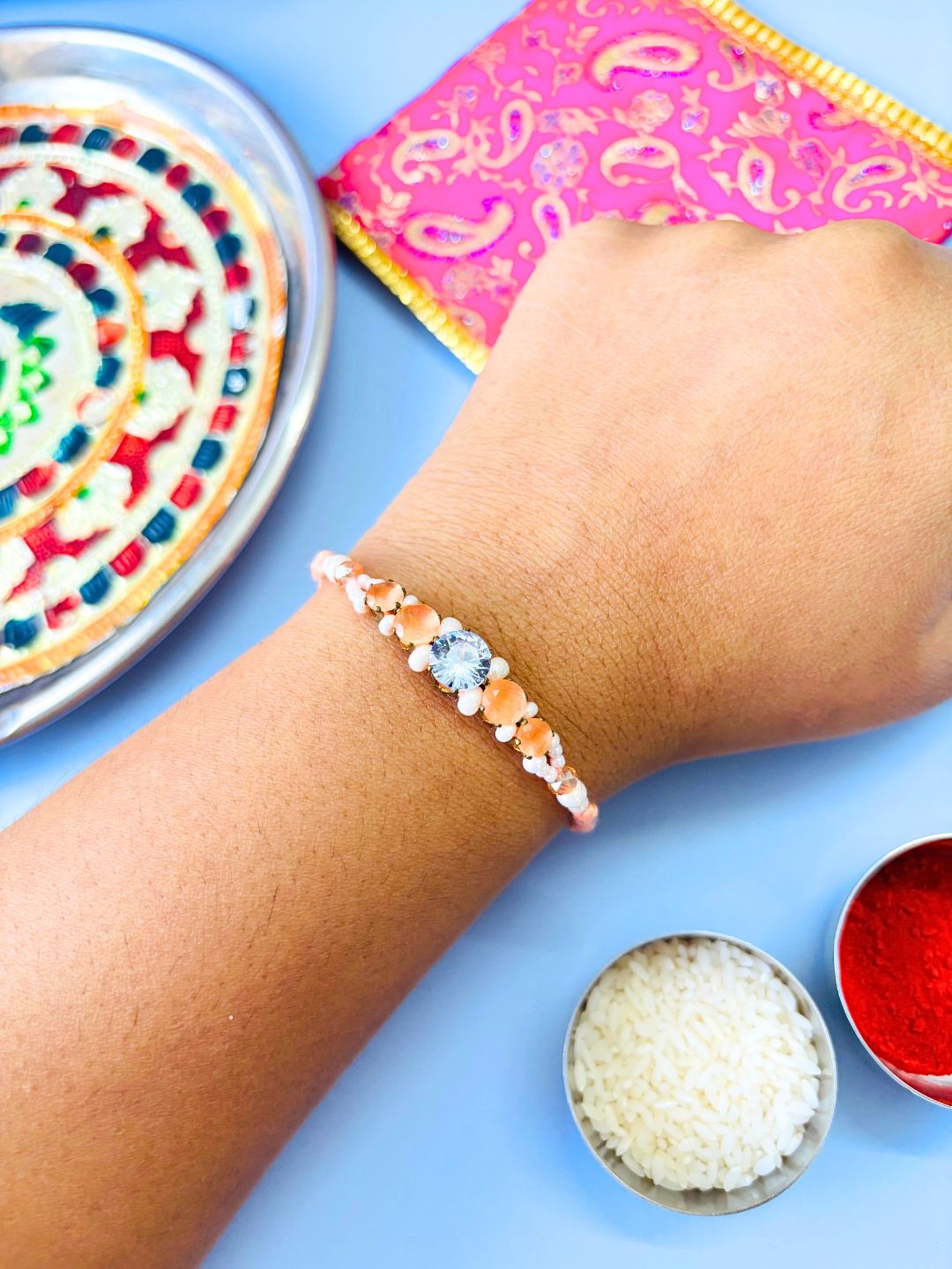 Orange AD Stone Rakhi with Roli Chawal for Brother