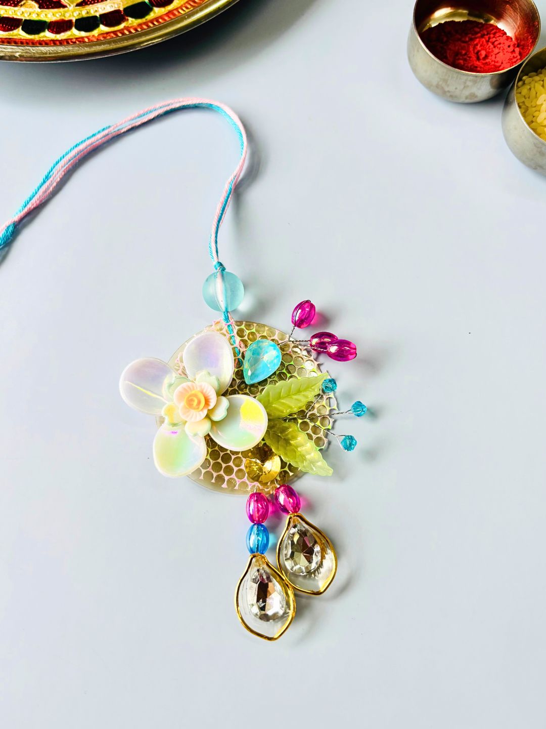 Multicolor Floral Lumba Rakhi Set for Bhaiya Bhabhi with Roli Chawal