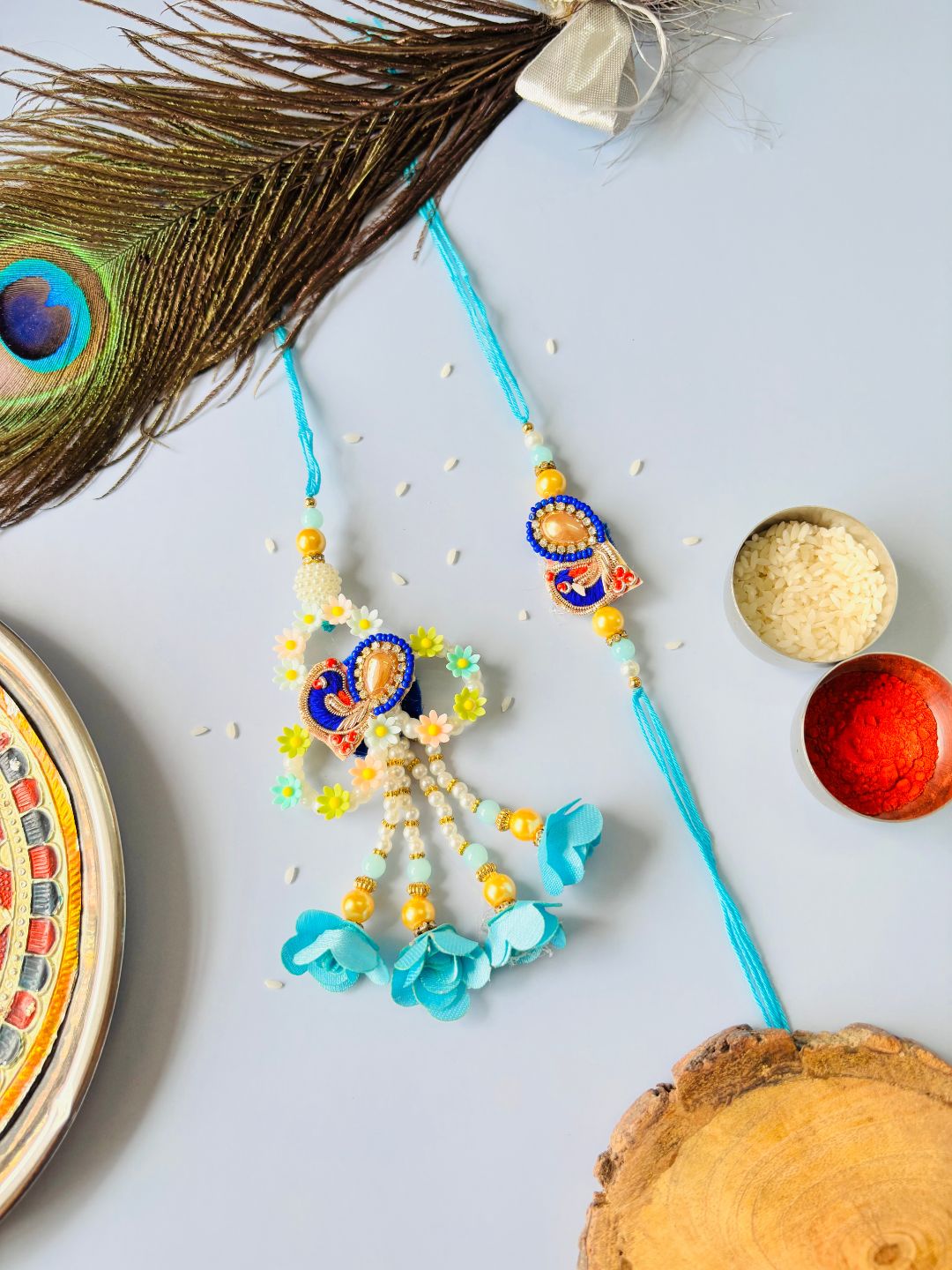 Blue Embellished Lumba Rakhi Set for Bhaiya Bhabhi with Roli Chawal