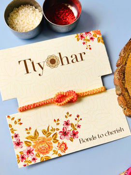 Orange Beaded Thread Rakhi with Roli Chawal