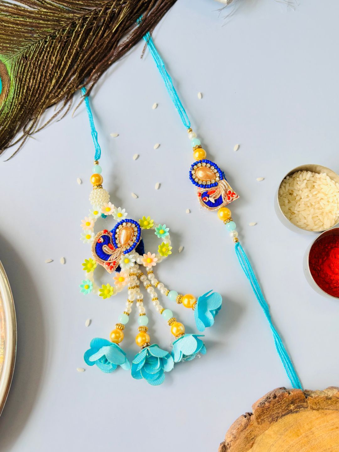 Blue Embellished Lumba Rakhi Set for Bhaiya Bhabhi with Roli Chawal