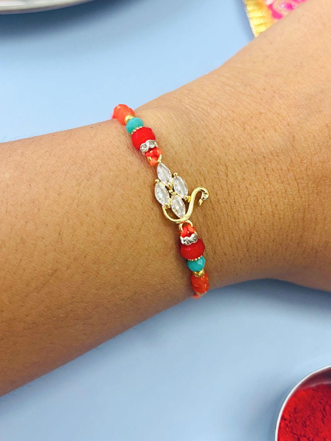 AD Stone Rakhi with Swan Accent with Roli Chawal for Brother