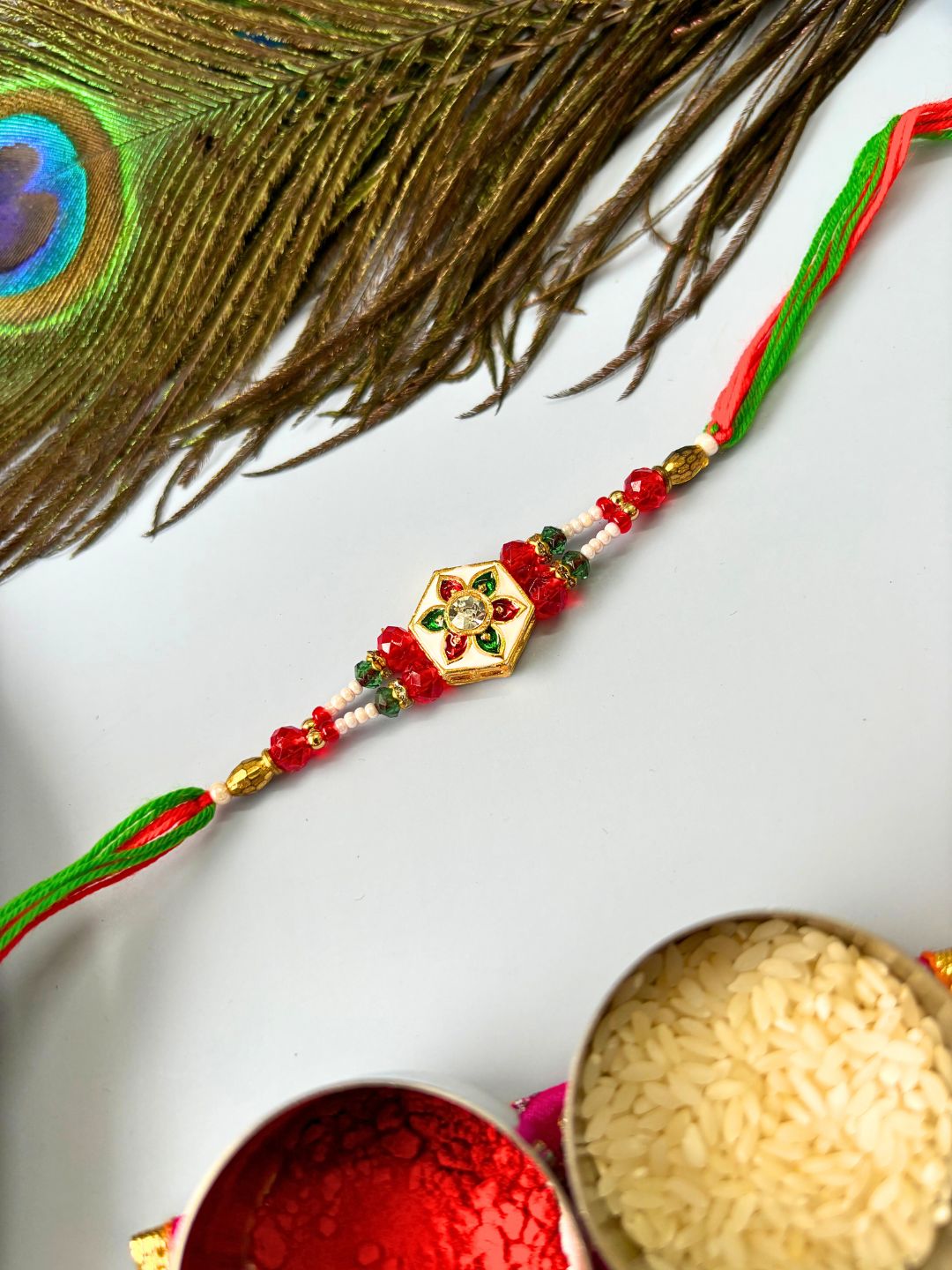 Meenakari Rakhi with Roli Chawal for Brother in Floral Accent
