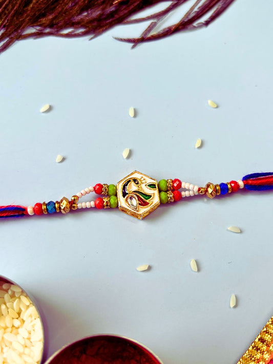 Traditional Meenakari Kundan Rakhi with Roli Chawal for Brother in Peacock Accent (Multicolor)