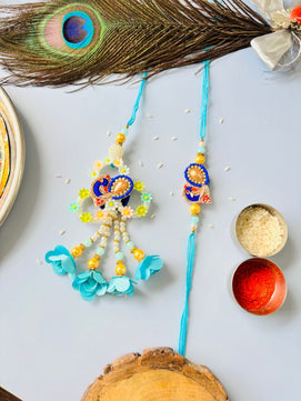 Blue Embellished Lumba Rakhi Set for Bhaiya Bhabhi with Roli Chawal
