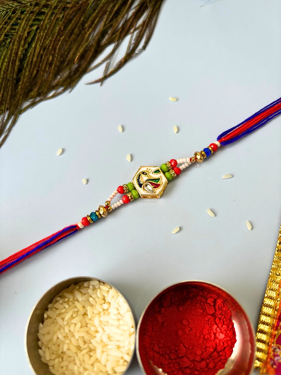Traditional Meenakari Kundan Rakhi with Roli Chawal for Brother in Peacock Accent (Multicolor)