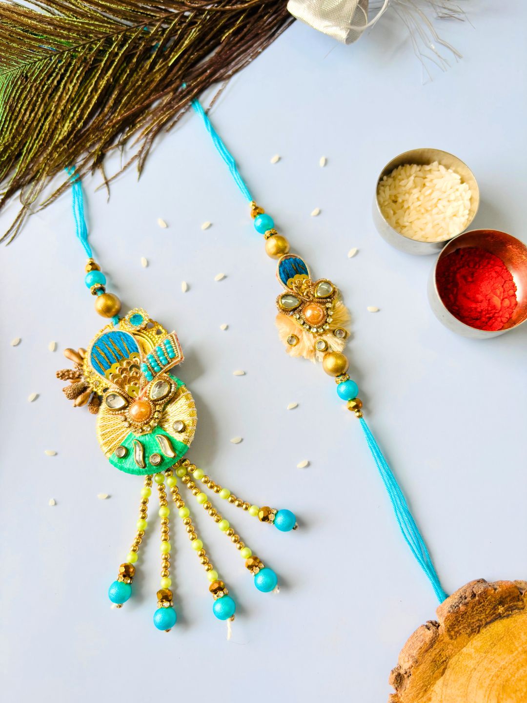 Blue Embellished Lumba Rakhi Set for Bhaiya Bhabhi with Roli Chawal