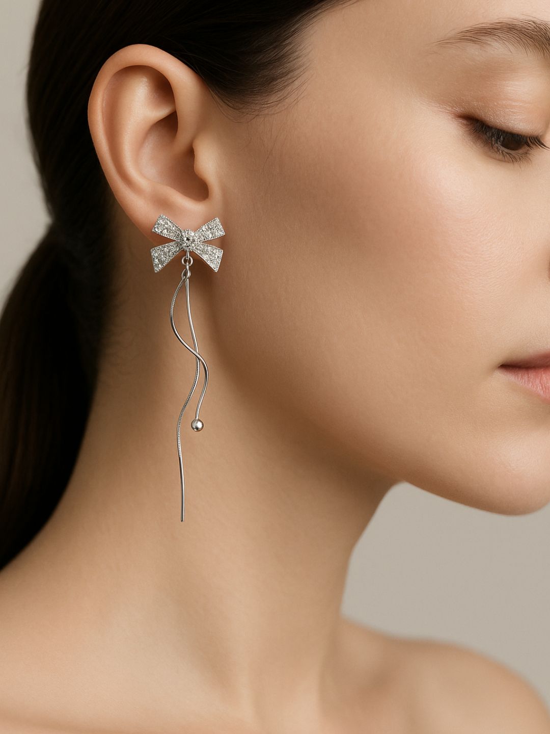 Silver Bow Dangler Earrings
