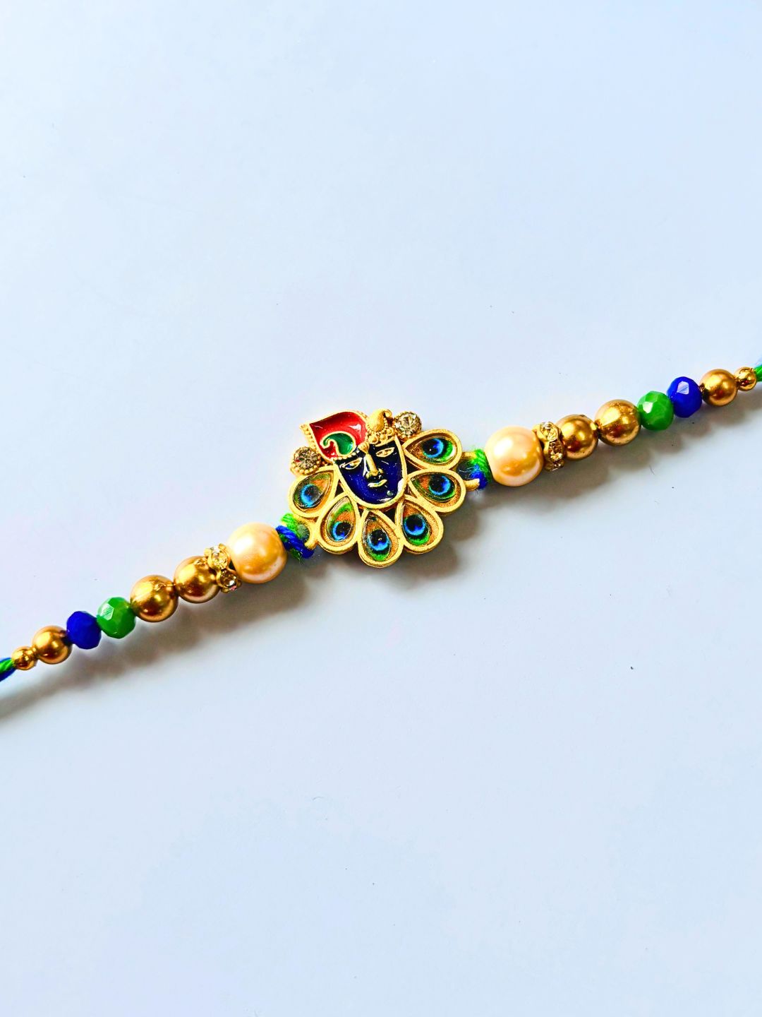 Traditional Krishna ji Kundan Meenakari Rakhi with Roli Chawal