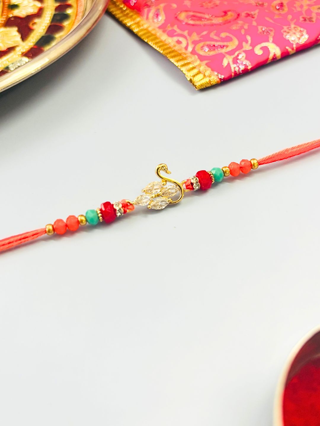 AD Stone Rakhi with Swan Accent with Roli Chawal for Brother