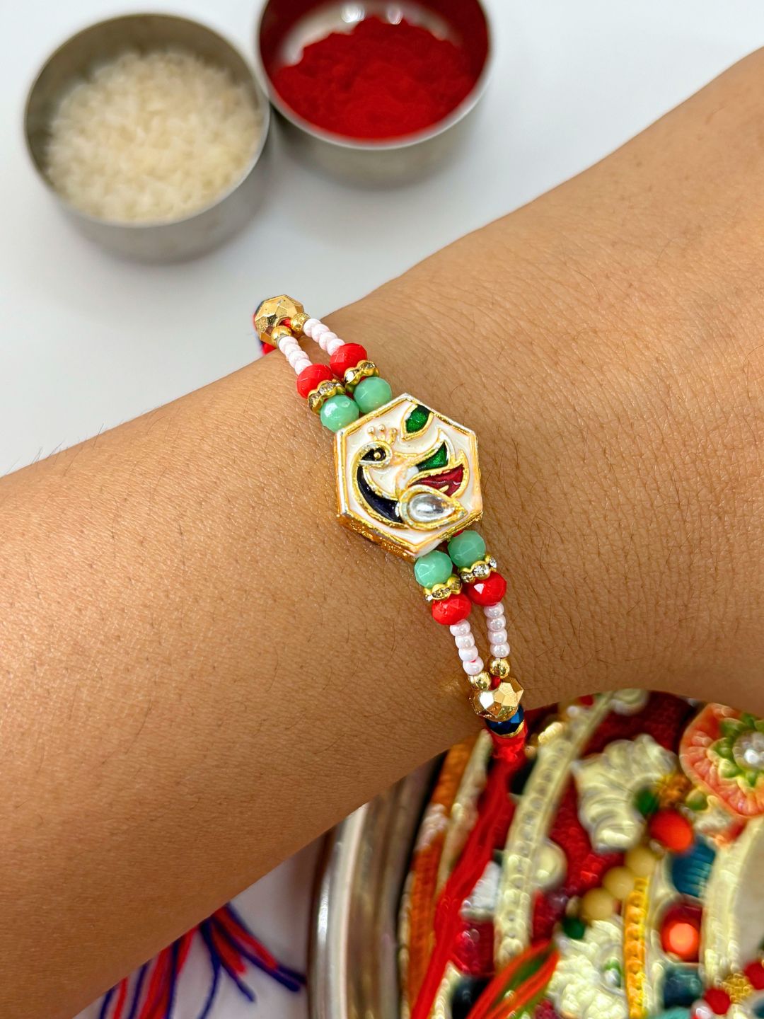 Traditional Meenakari Kundan Rakhi with Roli Chawal for Brother in Peacock Accent (Multicolor)