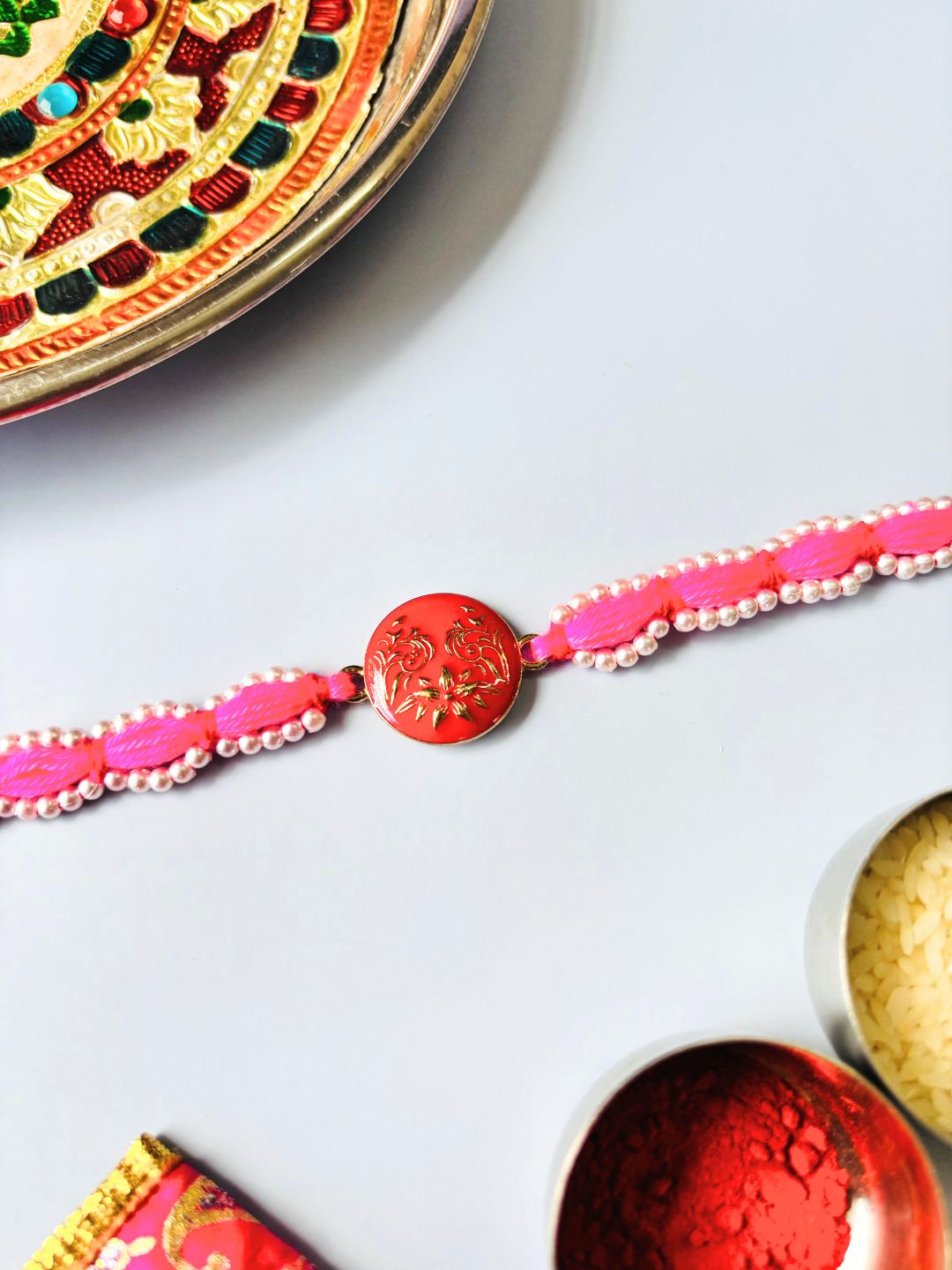 Cute Pink Bracelet Rakhi Bracelet with Roli Chawal for Sister