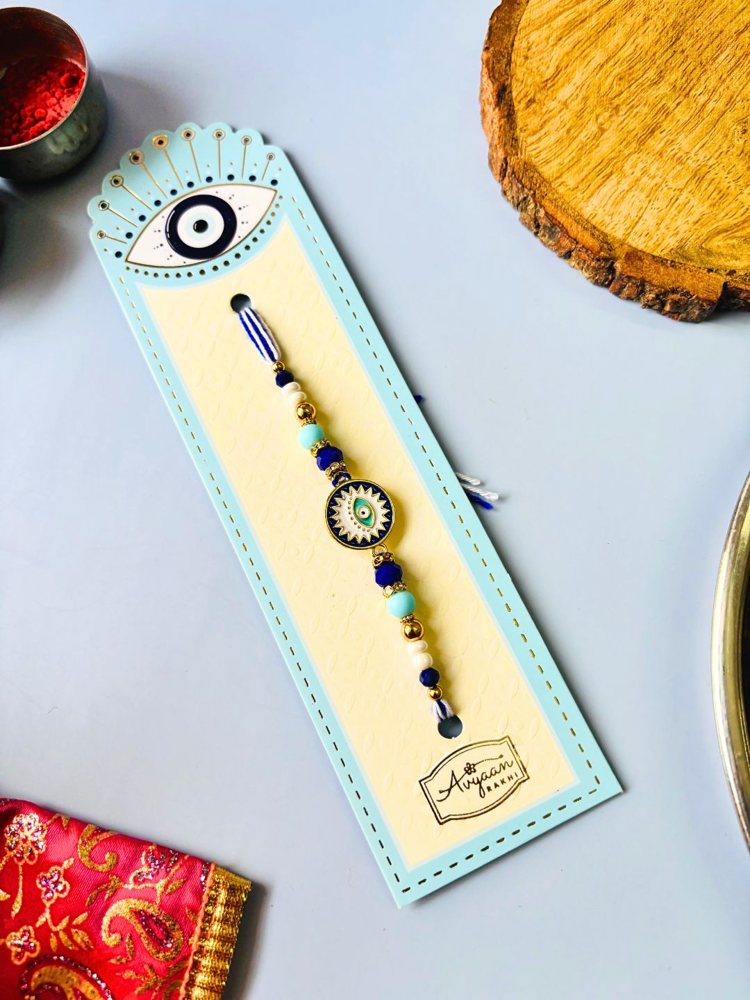 Evil Eye Enamelled Rakhi with Roli Chawal