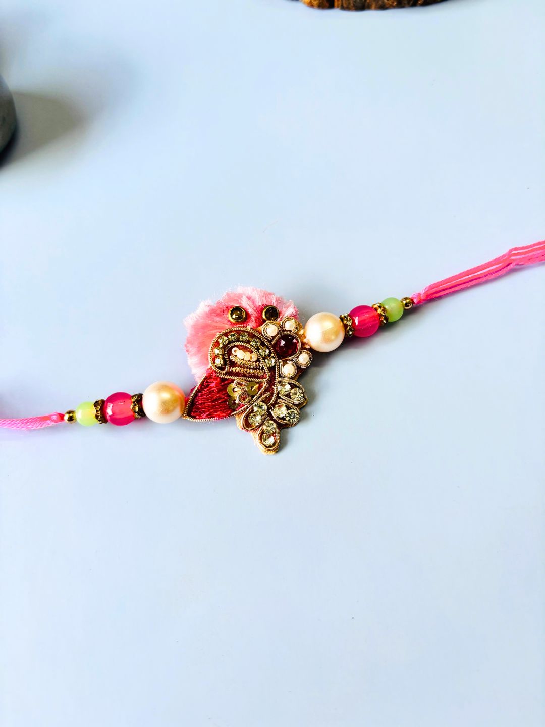 Pink Embellished Lumba Rakhi Set for Bhaiya Bhabhi with Roli Chawal