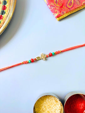 Om AD Stone Rakhi with Floral Accent with Roli Chawal for Brother
