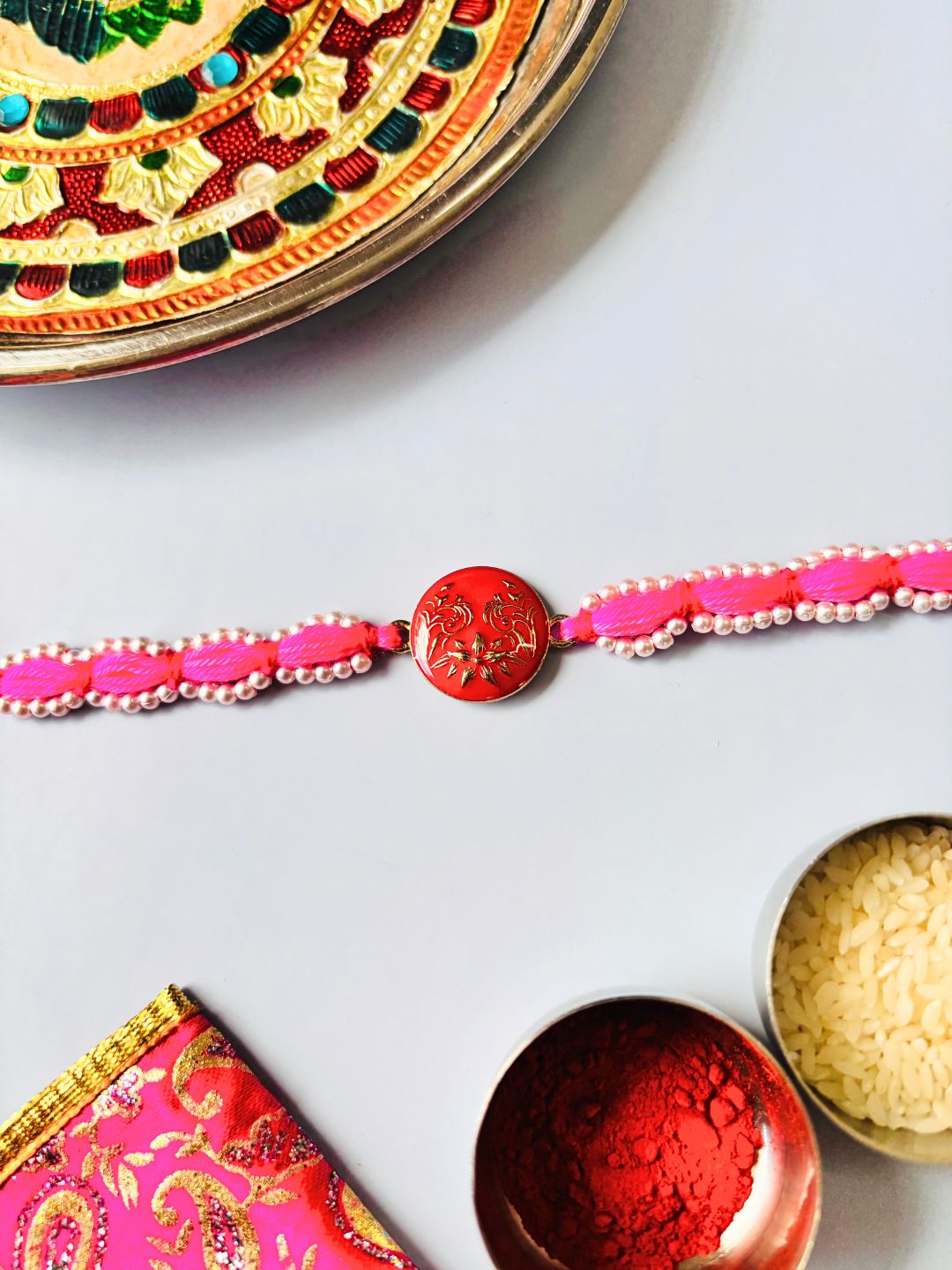 Cute Pink Bracelet Rakhi Bracelet with Roli Chawal for Sister