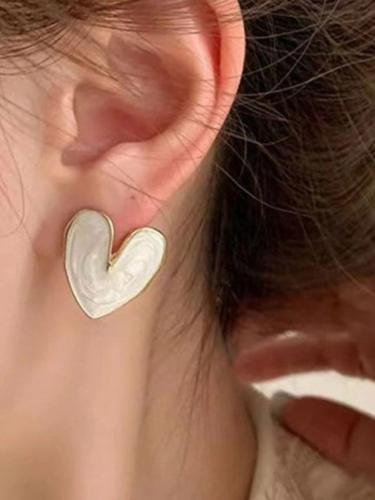 White heart-shaped gold bordered stud earrings from Tipsy Closet